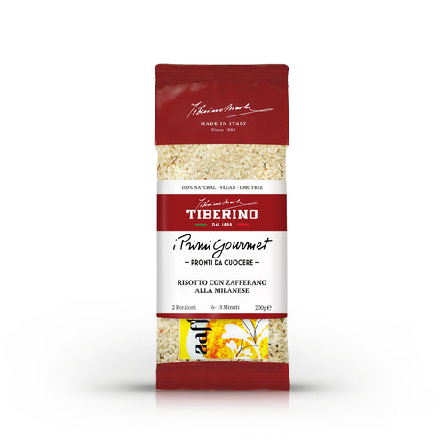 Confezione rossa e trasparente di Risotto con Zafferano alla Milanese Tiberino 1888, 200g, con riso visibile.