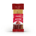 Confezione di spaghetti Tiberino 1888 Assassina, pasta lunga gialla con spezie rosse, etichetta rossa con piatto di spaghetti piccanti.