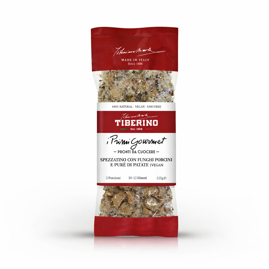 Confezione trasparente e rossa di Spezzatino con funghi porcini e purè di patate vegan Tiberino 1888, 125g.